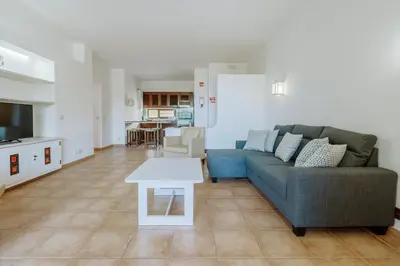 a living room with a couch and a table at Apartment Green Oasis in Albufeira Jardim mit Pool in Albufeira