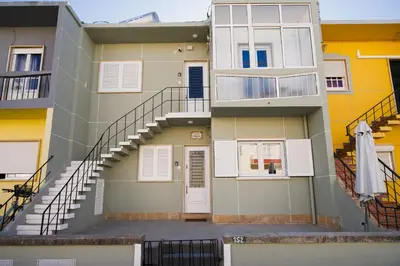 an apartment building with stairs and a stair case at Casas Sao Luis in Faro