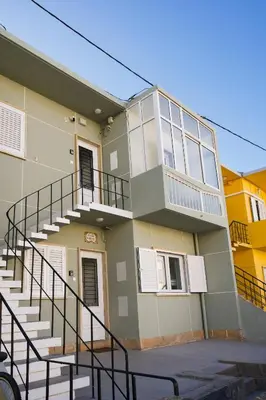 a building with a staircase on the side of it at Casas Sao Luis in Faro
