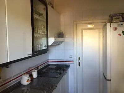 a small kitchen with a sink and a refrigerator at Vila Lusa Marina in Vilamoura
