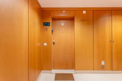 a row of wooden elevators in a building at Penthouse with Pool View in Albufeira by Lovelystay in Albufeira