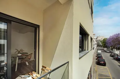 an apartment balcony with a view of a street at Stay Apartment in Faro