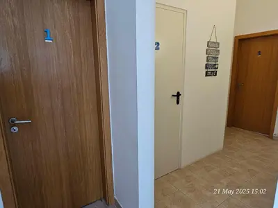 a room with a door and a hallway with a door at Blife Cerya private rooms at Faro beach in Faro