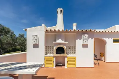 a model of a house with a fireplace on a patio at Aldeamento Aldeia do Golf V3 in Vilamoura