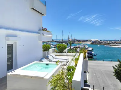 a balcony with a hot tub and a view of the water at Allianca Marina - Luxury apartment by HD in Vilamoura
