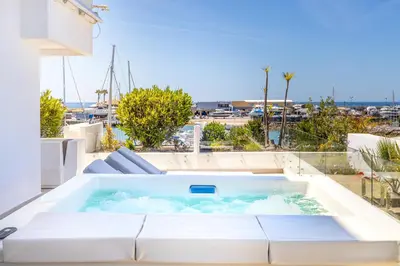 a hot tub on the balcony of a house at Allianca Marina - Luxury apartment by HD in Vilamoura
