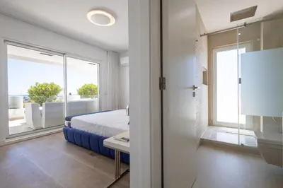 a bedroom with a bed and a large window at Allianca Marina - Luxury apartment by HD in Vilamoura