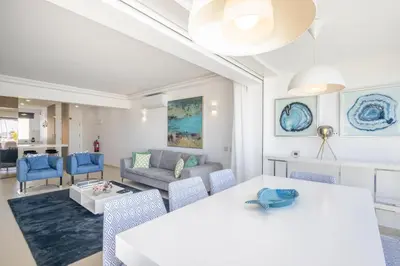 a living room with a white table and chairs at Allianca Marina - Luxury apartment by HD in Vilamoura