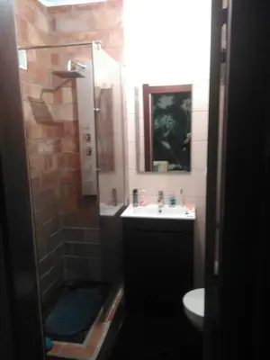 a bathroom with a sink and a shower and a toilet at 2 bedroom Apartment Falésia Beach in Albufeira