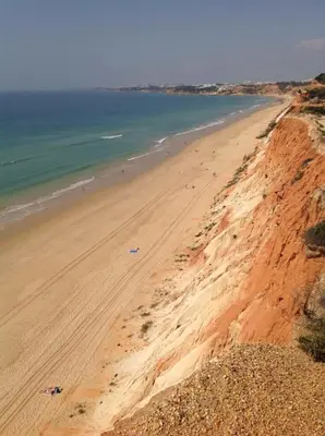 an aerial view of a beach with people on it at 2 bedroom Apartment Falésia Beach in Albufeira