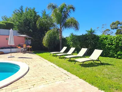 a living room with a couch and a fireplace at La Balaia - charm and comfort 12 people 9 beds in Albufeira