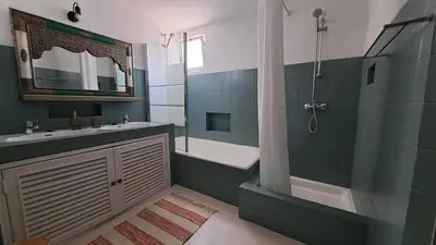 a bathroom with a shower and a sink and a tub at La Balaia - charm and comfort 12 people 9 beds in Albufeira