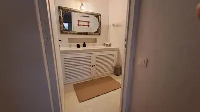 a bedroom with two beds and a lamp on a table at La Balaia - charm and comfort 12 people 9 beds in Albufeira