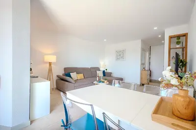 a living room with a couch and a table at Salgados Sunset and Sea View Apartment in Guia
