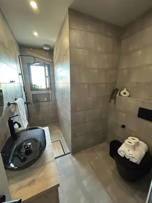 a bathroom with a sink and a toilet at Beach penthouse paradise T4 in Quarteira