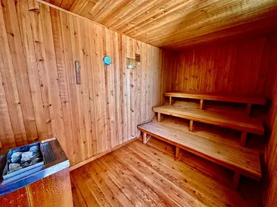 a wooden sauna with a bench in a room at Villa SOLAR DO MONTE 6 in Albufeira