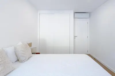a living room with a couch and a table and a bed at Albufeira Old Town Apartment in Albufeira