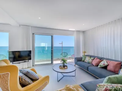 a living room with a couch and a table at Holiday Home Nannoush - Vip Properties by Interhome in Albufeira