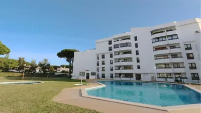 a building with a swimming pool in front of a building at Tenis Golf Mar A209 - CD 309 - Sleeps 2 adults and 2 children in Vilamoura
