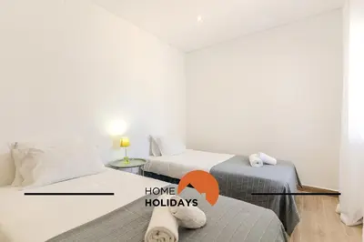 a room with two beds and a room with a room with at #331 Casa Chico Rita by Home Holidays in Sesmarias
