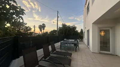 a patio with a table and chairs on a balcony at Figo by Check-in Portugal in Quarteira