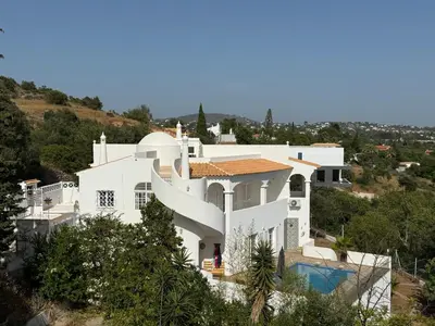 a white house on top of a hill at Solar dos Lirios in Loulé