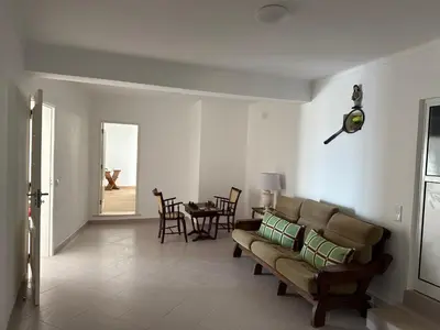 a living room with a couch and a table at Solar dos Lirios in Loulé