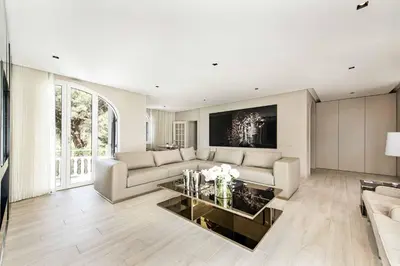 a living room with a couch and a table at Villa Melvin in Quarteira