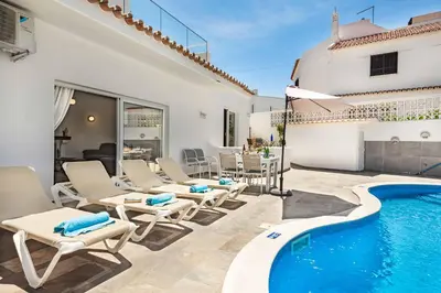 a villa with a swimming pool and a patio at Villa Barbara in Albufeira