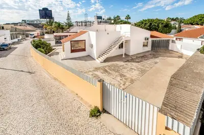 an aerial view of a house with a fence at Villa Mogan in Albufeira
