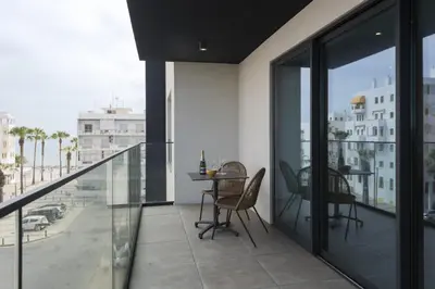 a balcony with a table and chairs on it at Terracos de Quarteira II Caribe by Real Properties in Quarteira