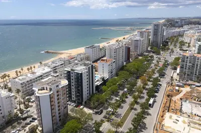 an aerial view of a city and the beach at Terracos de Quarteira II Caribe by Real Properties in Quarteira