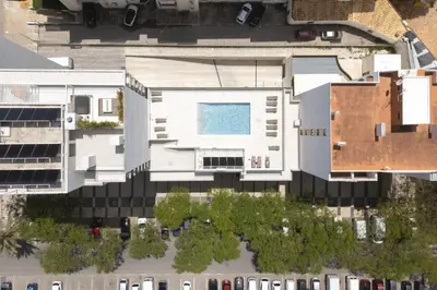 an aerial view of a building with a swimming pool at Terracos de Quarteira II Caribe by Real Properties in Quarteira