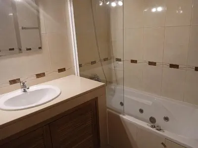 a bathroom with a sink and a shower at Albufeira Baixa Apartment in Albufeira