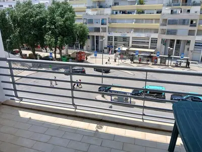 a view of a city street with cars and people at Albufeira Baixa Apartment in Albufeira