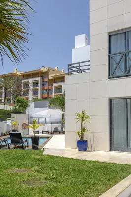 a building with plants in front of it at Villa Velluto in Albufeira