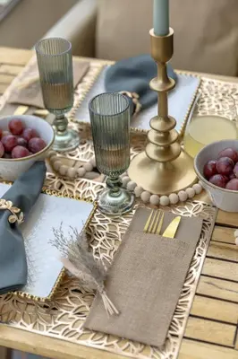 a dining room table with a table set with wine glasses at Ocean glimpse in Albufeira