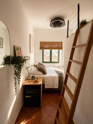 a bedroom with a bed and a dresser at Refúgio No16 Ocean Air & Rooftop Flair in Albufeira