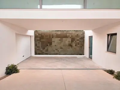 an empty garage with a brick wall at Villa São Rafael in Albufeira