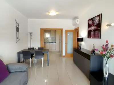 a living room with a couch and a table at Barracuda dom in Albufeira