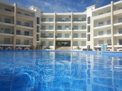 a large swimming pool in front of a building at Monte da Eira apt 62 in Albufeira