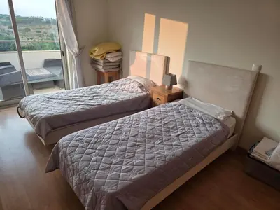 a hotel room with two beds and a window at Monte da Eira apt 62 in Albufeira