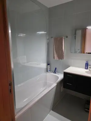 a white bathroom with a tub and a sink at Monte da Eira apt 62 in Albufeira