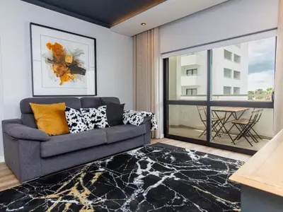 a bedroom with two beds and a large mirror at Oásis Apartment by Stay ici Algarve Holiday Rental in Albufeira