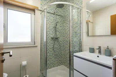 a bathroom with a shower and a sink at Villa da Ria - by HD Properties in Monte Negro