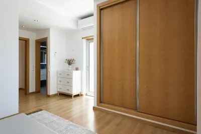 a large closet in a room with a wooden door at Villa da Ria - by HD Properties in Monte Negro