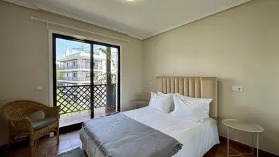 a bedroom with a bed and a large window at Sun by Check-in Portugal in Albufeira