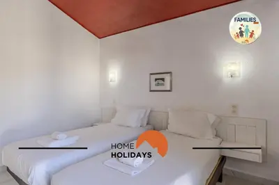 a bedroom with two beds and a sign that says have holidays at #329 Families Only - Jacaranda by Home Holidays in Albufeira