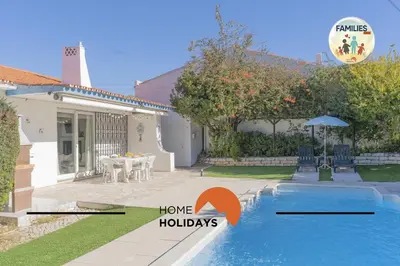 a house with a backyard with a swimming pool at #329 Families Only - Jacaranda by Home Holidays in Albufeira