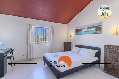 a bedroom with a bed and a desk in it at #329 Families Only - Jacaranda by Home Holidays in Albufeira